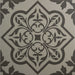 Decorative tile with intricate grey pattern on a white background