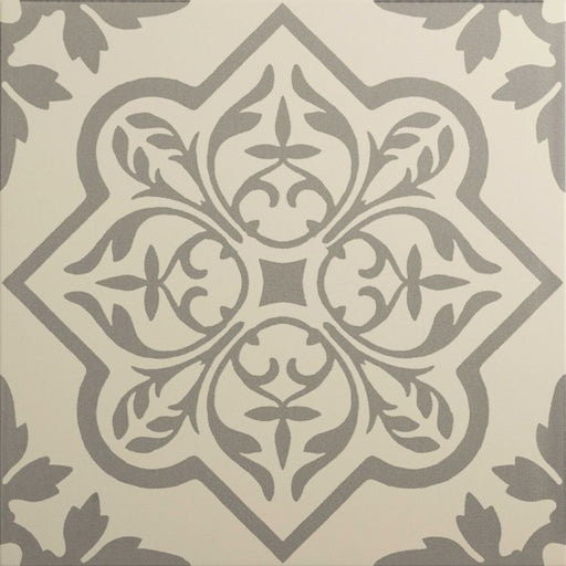 A square tile with a symmetrical grey floral and geometric pattern on a light beige background.