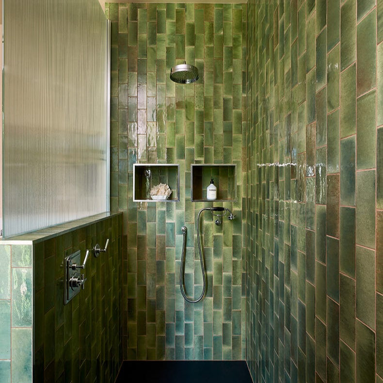 Image of Modern shower with green tiled walls and black floor