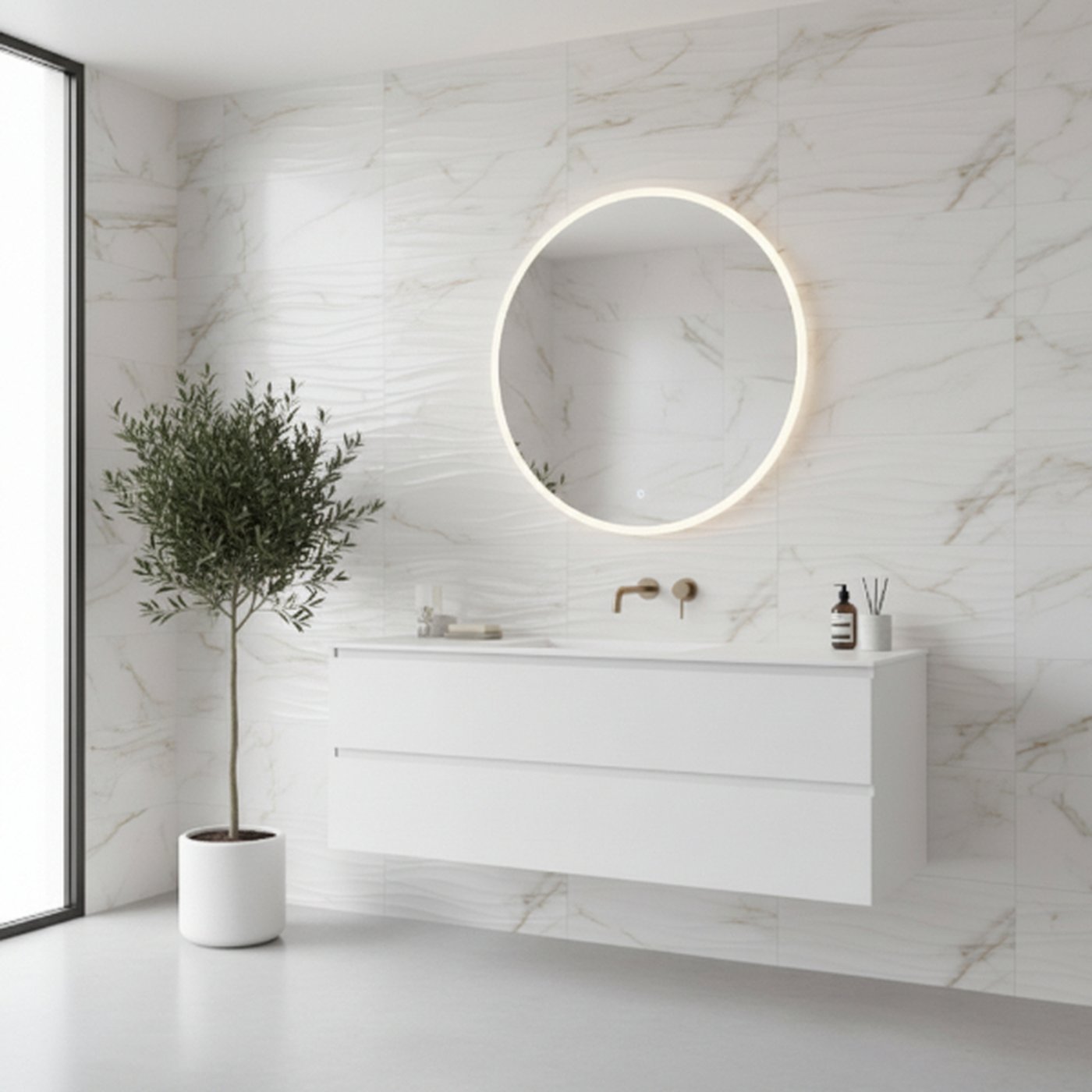 Image of Minimalist white floating bathroom vanity with a circular LED mirror, marble-effect wave tile feature wall, and a potted indoor tree in a bright modern bathroom.